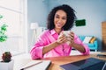 Photo of pretty young girl work drink coffee work netbook entrepreneur wear trendy pink outfit modern interior indoors Royalty Free Stock Photo