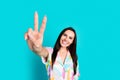 Photo of pretty young woman fingers demonstrate v-sign wear shirt isolated on teal color background