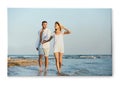 Photo printed on canvas, white background. Happy young couple on beach Royalty Free Stock Photo