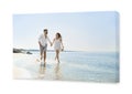 Photo printed on canvas, white background. Happy young couple running on beach near sea Royalty Free Stock Photo