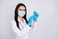 Photo of professional confident doc lady ready for operation young surgeon hold anesthesia syringe wear mask gloves Royalty Free Stock Photo