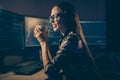 Photo of professional resting relaxing girl smiling toothily pleased about having done all necessary work drinking tea Royalty Free Stock Photo