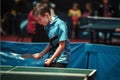 Professional table tennis player young boy. Junior. Championship tournament. Royalty Free Stock Photo