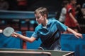 Professional table tennis player young boy. Junior. Championship tournament. Royalty Free Stock Photo