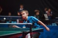 Professional table tennis player young boy. Junior. Championship tournament. Royalty Free Stock Photo