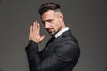 Photo in profile of elegant adult man 30s in black suit looking