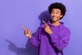 Photo promoter of youngster man chevelure wearing violet hoodie indicating fingers mockup interested brand isolated on