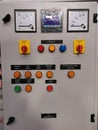 Photo of push buttons, elr, meters, selector switch and pilot lamps mounted on electrical door.