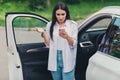 Photo of puzzled girl ride drive city road lost stop car check smartphone gps navigation look screen no signal feel Royalty Free Stock Photo