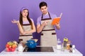 Photo of puzzled unsure boyfriend girlfriend dressed chef outfit thinking ingredients proportions isolated purple color