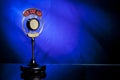 Photo of radio microphone on blue background Royalty Free Stock Photo