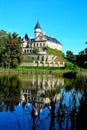 View of Radun castle in the autumn rays of the sun on a background of blue sky