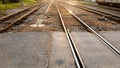 The sun reflects off the railroad tracks