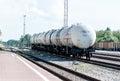 Photo of railway tracks of a railway station with a view of railway cars