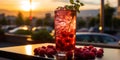 Photo of raspberry mochito in a high glass decorated with mint leaves, against the background of s