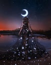 Photo real people Fantasy woman queen night lady moon walks on water crown glows, black dress shining stars fairy girl Royalty Free Stock Photo