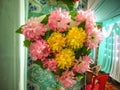 Beautiful multicolored artificial flowers With Chair India