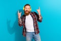 Photo of redhair beard businessman hipster rock roll music show brutal fingers listen wireless earphones isolated on Royalty Free Stock Photo