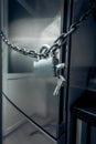 Photo of refrigerator locked by chain and metal lock Royalty Free Stock Photo