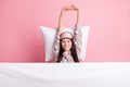 Photo of relaxing charming young lady nightwear mask covering blanket lying pillow stretching isolated pink color