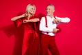 Photo of retired husband and wife have fun event retro xmas dancer elegant dress concert isolated over red color Royalty Free Stock Photo