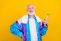 Photo of retired man sweating drinking fresh water intense activity isolated over yellow color background