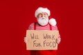 Photo of retired resigned grandpa white beard hold card seek job hungry desperate hopeful wear santa x-mas costume