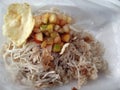 photo of rice and tempeh, chicken crackers, pickles