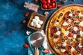 In the photo in the right corner, we see a piece of pizza. Around her there is a composition of mushrooms, tomatoes and other