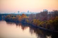 Photo of river, trees, evening city .