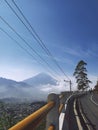 Photo, road with mountains in the background.