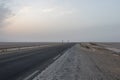 The photo of a road through the salt lake Chott el Djerid Royalty Free Stock Photo