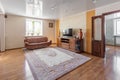 Photo of a room in warm colors, a small cozy room with a sofa and carpet Royalty Free Stock Photo