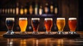 Photo of a row of beer glasses on a wooden table