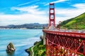 Rush hour traffic on the Golden Gate Bridge on a beautiful afternoon with gorgeous clouds in the sky.