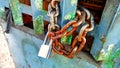 photo of rusted chain and worn lock.