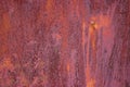 Photo of a rusty sheet of metal with a hammered nail, perfect for different screensavers