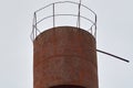 Photo of rusty metal water tower