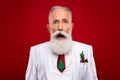 Photo of sad aged grey hair man open mouth wear white jacket isolated on red color background Royalty Free Stock Photo