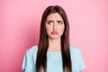 Photo of sad young lady bad mood crying offended wear casual blue t-shirt isolated pink pastel color background