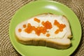 sandwich with red caviar on a plate