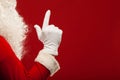 Photo of Santa Claus gloved hand in pointing Royalty Free Stock Photo