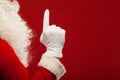 Photo of Santa Claus gloved hand in pointing Royalty Free Stock Photo