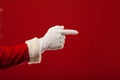Photo of Santa Claus gloved hand in pointing Royalty Free Stock Photo