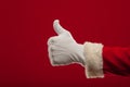 Photo of Santa Claus gloved hand in pointing gesture. fingers Royalty Free Stock Photo