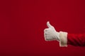 Photo of Santa Claus gloved hand in pointing gesture. fingers Royalty Free Stock Photo