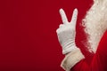 Photo of Santa Claus gloved hand in pointing gesture. fingers Royalty Free Stock Photo