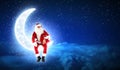 Photo of santa claus sitting on the moon