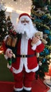 santa claus with little teddy bear brings christmas gifts Royalty Free Stock Photo