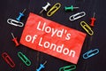 The photo says Lloyd`s of London. Notepad, marker